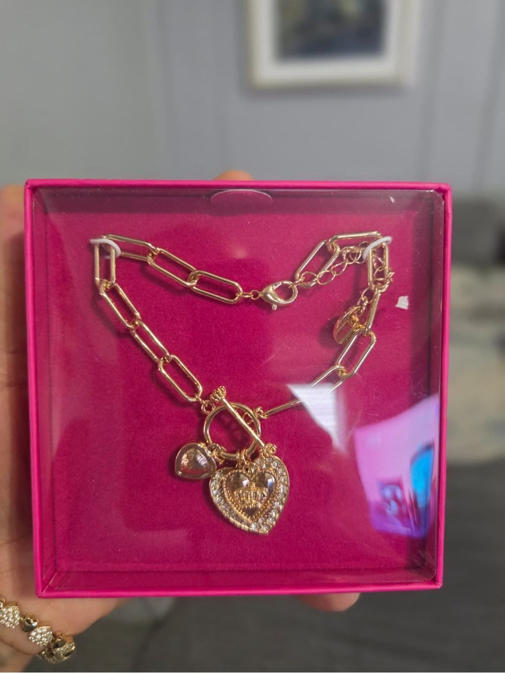 Juicy Couture Gold heart charm necklace with diamond-like embellishments